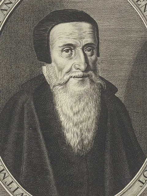 Gravura de Menno Simons com solidéu e longa barba branca, numa moldura oval.